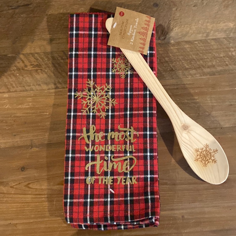 Two kitchen towels and wooden spoon.